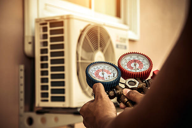 Professional Air Conditioning Service technician working in Chester Heights, PA